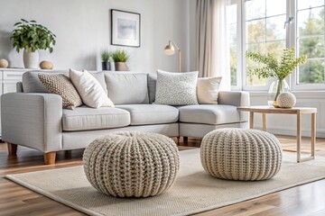 Obraz premium Two knitted poufs near white color corner sofa. Scandinavian home interior design of modern living room
