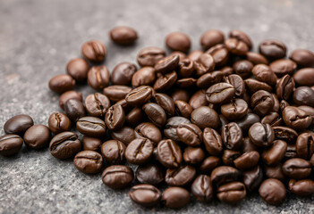 Fototapeta premium Roasted coffee beans on a textured background