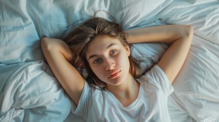 Fototapeta premium Top view of skinny girl wearing comfortable clothes in bedroom