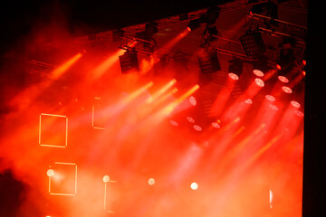 Red-orange color on stage at a concert