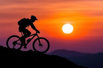 A mountain biker silhouetted against a vibrant sunset, showcasing adventure and the beauty of nature.