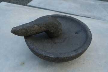 Close-up of a stone mortar and pestle.