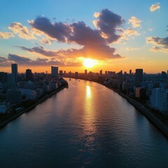 Obraz premium High-angle shot of the Sumida River, Tokyo's skyline visible on either side, as the sun sets in the distance