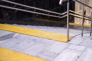 vibrant yellow rubber anti-slip surface enhances the safety of stone steps, merging functionality...