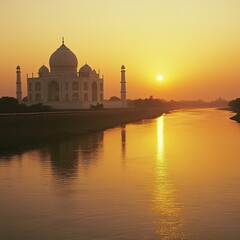 Sunset over the Taj Mahal, with golden light reflecting off the marble surfaces and the Yamuna River nearby