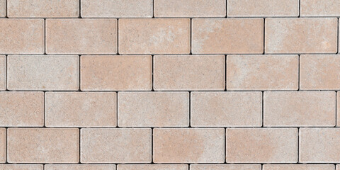 Textured stone tiles lines wall texture masonry brick abstract background of  beige sandstone facade for wallpaper