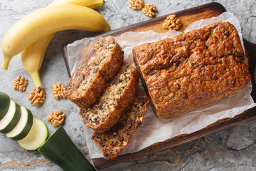 Homemade gluten free zucchini banana bread with walnuts and dark chocolate topping close-up on...