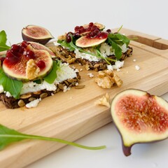 Toast with Figs, Cheese and Arugula on Bread Slice Photo