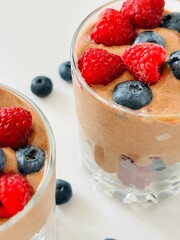 Berry Dessert in Glass with Banana Cacao Cream Photo