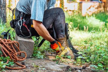 Different safety equipment for arborist or arborists such as ropes, anchors, straps and so on. Detail of arborist equipment.