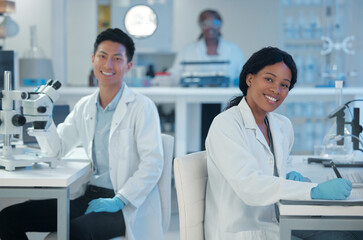 Portrait, smile and team in laboratory for science, healthcare scientific findings at microscope. Scientists, happy and tech in research facility for microbiology, vaccine development and chemistry