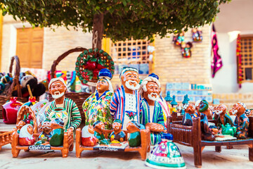 Funny ceramic figures of people at a street bazaar in Ichan Kala, Khiva's Inner Town.