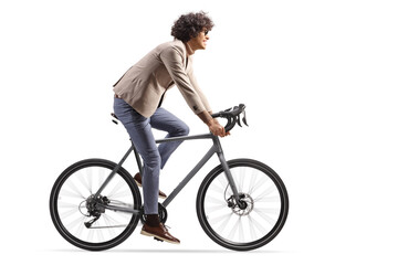 Naklejka premium Full length profile shot of a man in suit riding a bicycle