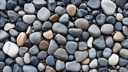 Naklejka premium A close-up shot of a smooth, pebble stone surface with various colors.
