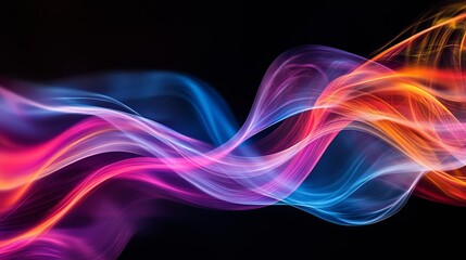 Naklejka premium Colorful fluid waves of light creating an abstract art effect in the dark