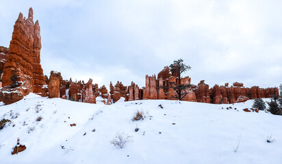 Snow scene colorful cliffs with red rock and stone in Bryce Canyon National Park