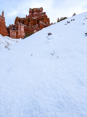 Snow scene colorful cliffs with red rock and stone in Bryce Canyon National Park