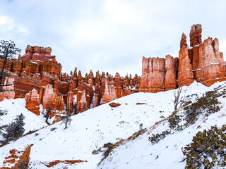 Snow scene colorful cliffs with red rock and stone in Bryce Canyon National Park