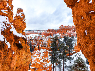 Snow scene colorful cliffs with red rock and stone in Bryce Canyon National Park