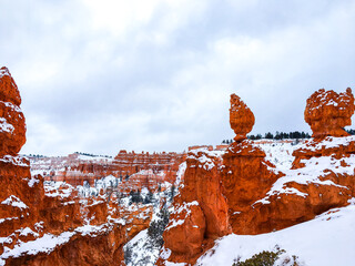 Snow scene colorful cliffs with red rock and stone in Bryce Canyon National Park