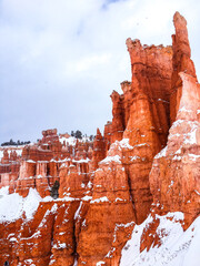 Snow scene colorful cliffs with red rock and stone in Bryce Canyon National Park