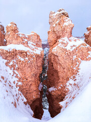 Snow scene colorful cliffs with red rock and stone in Bryce Canyon National Park