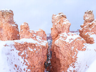 Snow scene colorful cliffs with red rock and stone in Bryce Canyon National Park