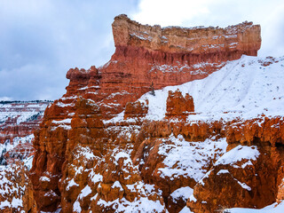 Snow scene colorful cliffs with red rock and stone in Bryce Canyon National Park