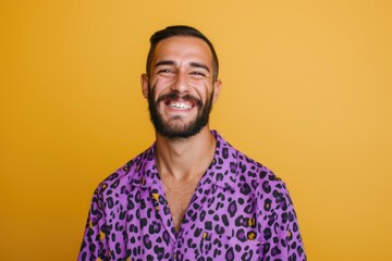 Obraz premium Happy young gay man in purple animal print shirt.