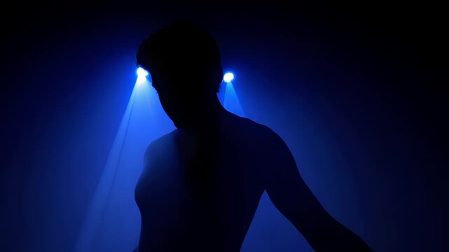 Person against a spotlight background.