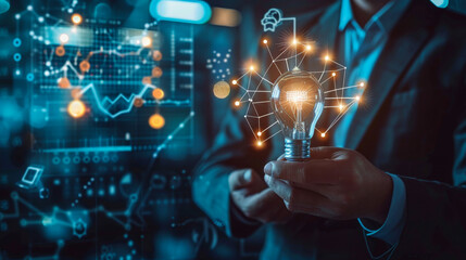 Businessman holding creative light bulb with growth graph and knowledge management system icons