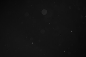 abstract dust particles over black background for overlay