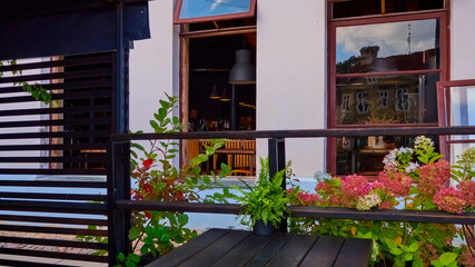 Fototapeta premium Cafe in the old town. Cityscape. Kuldiga, Latvia.