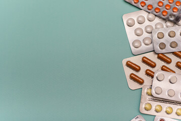 Pills in blisters on a blue background