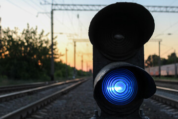 traffic light for trains on the tracks. blue traffic lights on the railroad