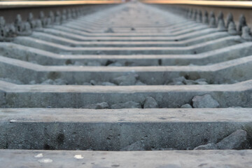 close-up of the railroad for trains. Close-up perspective view of railroad tracks.