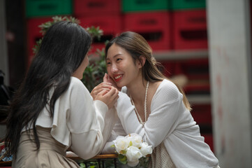 Happy Asian lesbian lgbtq couple dating in love