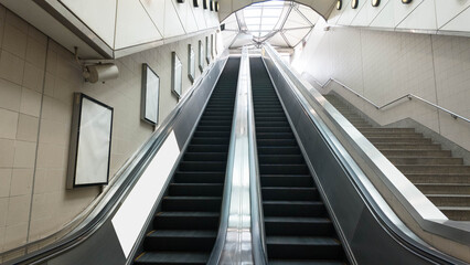 Fototapeta premium escalator staircase up down business modern city architecture indoor subway mock up white advertisement sale airport station railway loading moving up travel shopping elevator outdoor futurist center