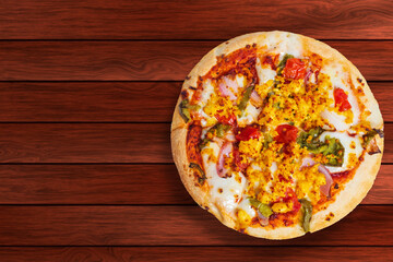 Pizza isolated on wooden table with copy space.