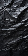 Obraz premium Wrinkled black plastic wrap texture background