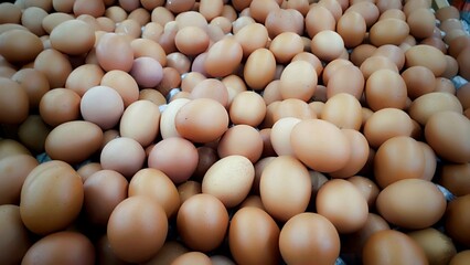 Chicken egg supply in supermarket.  Raw chicken eggs. pile of raw chicken eggs. Egg contains high protein and important for health.