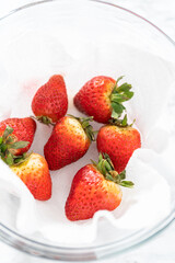 Washed and Dried Strawberries Neatly Stored in a Glass Bowl