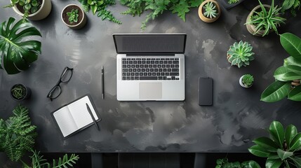 A laptop computer sitting on a table with plants