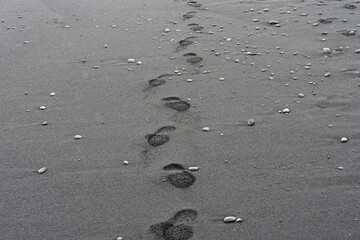 Traces of the men in the sand. Photo from Diamond Beach in south Iceland.
