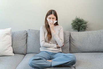 Obraz premium Female unhealthy Sickness, asian young woman, girl unwell and coughing, have cold, sore throat isolated white background suffering with symptom cough feeling bad. Healthcare of Coronavirus, covid-19.