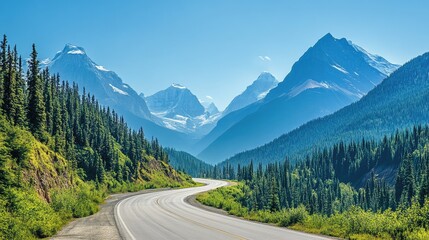 Fototapeta premium A scenic mountain road winding through lush green forests, with majestic peaks in the background and a clear blue sky above, capturing the beauty of a high-altitude drive.