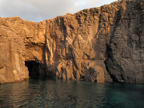 entry to a sea cave (littoral cave) at the coast of Sant'Antioco island near Sardinia, Italy, Europe