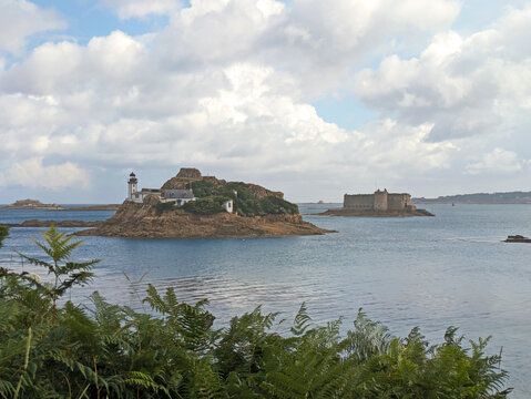 The lighthouse of &Icirc;le Lou&euml;t with Ch&acirc;teau du Taureau (Taureau Fort) in the background in the bay of Morlaix, Bretagne (Brittany), France