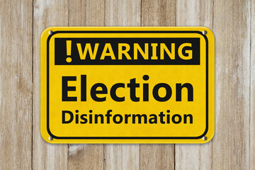 Fototapeta premium Warning Election Disinformation sign on wood