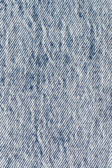 Close-up of stonewashed denim fabric. Denim, textured background image.
